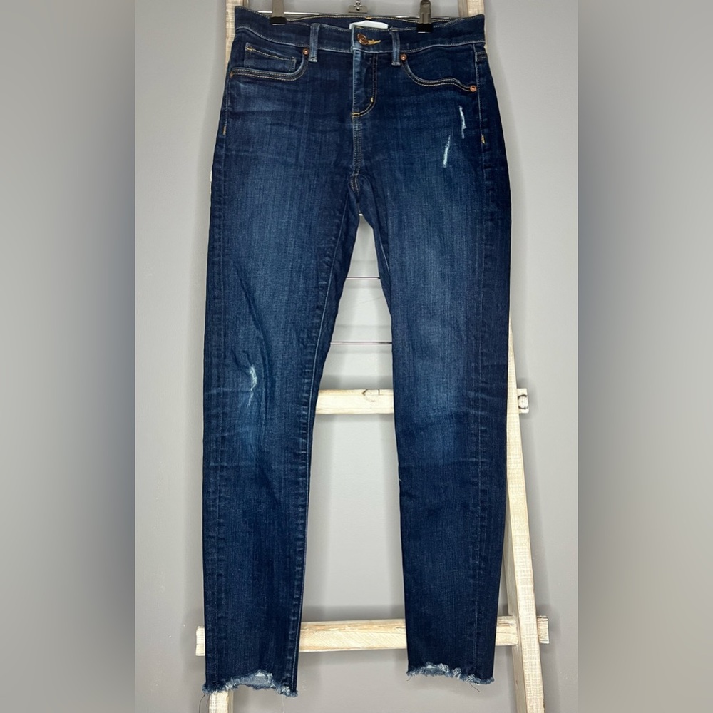 Ann Taylor Loft Size 0 modern skinny Jeans distressed with raw hem.